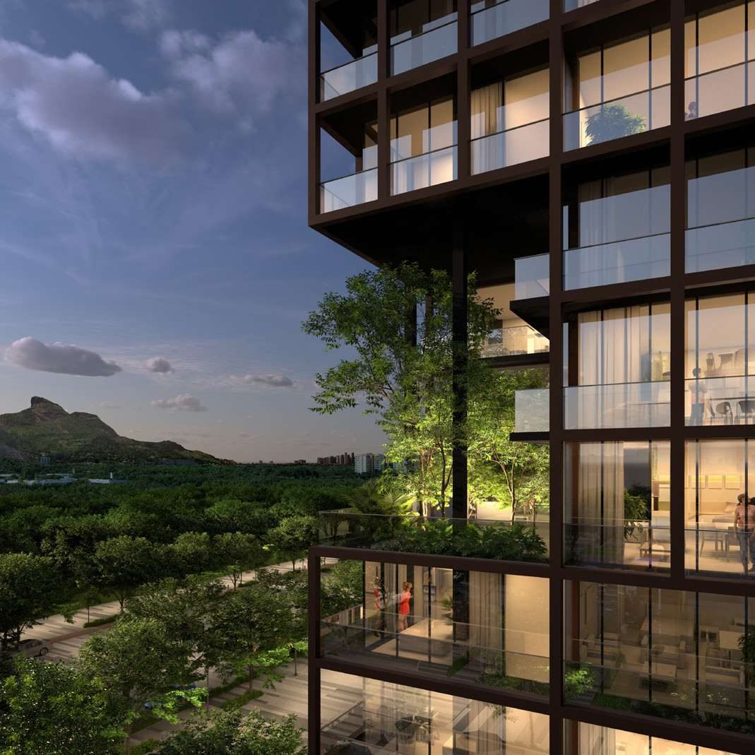 Varanda do Arte Design Residencial com vista para a Pedra da Gávea ao entardecer