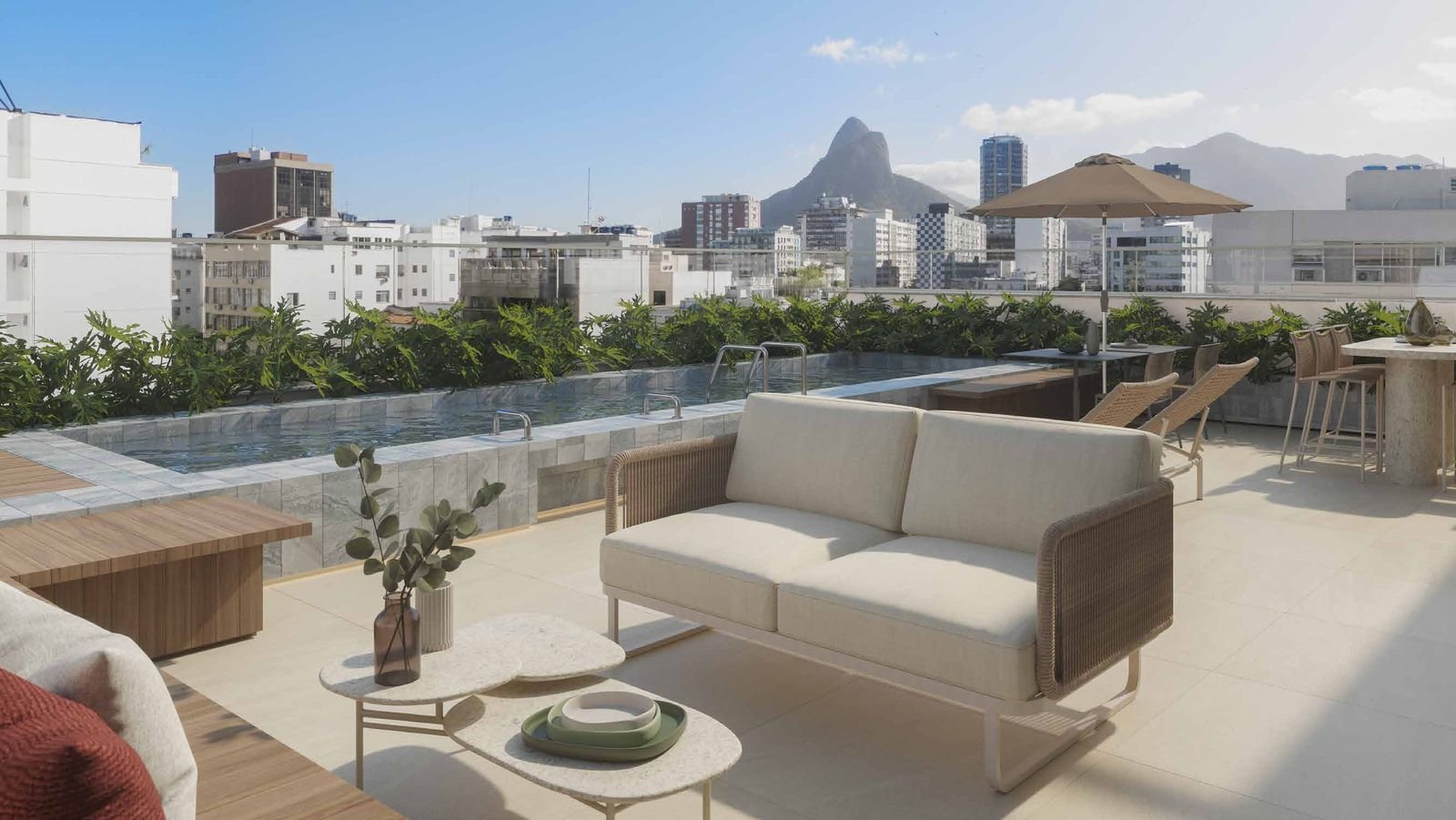 Open-air lounge on the Be.in.Rio Barão da Torre rooftop with views of Dois Irmãos