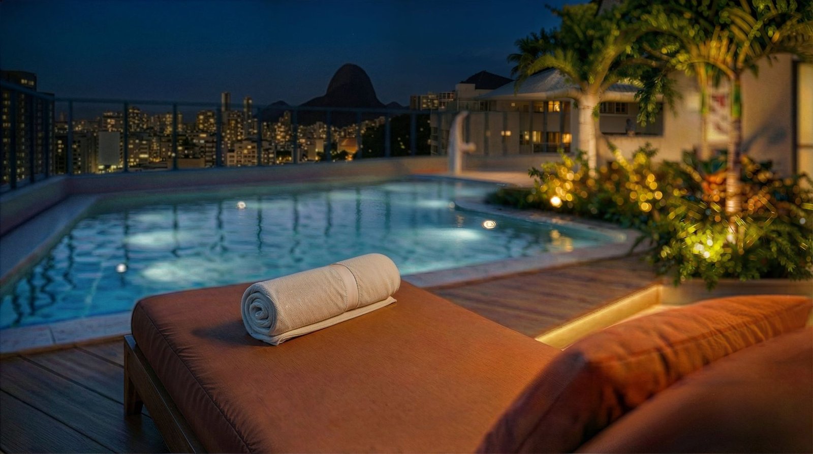 Guima Botafogo pool at night with a view of Sugarloaf Mountain