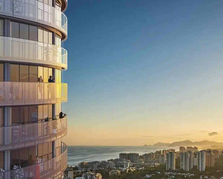 Cylindrical tower of Niemeyer 360 Residences at sunset in Barra da Tijuca