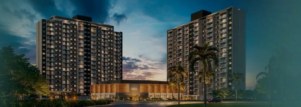 The two Ilha Stay Home Resort buildings at dusk, with the mall between the towers